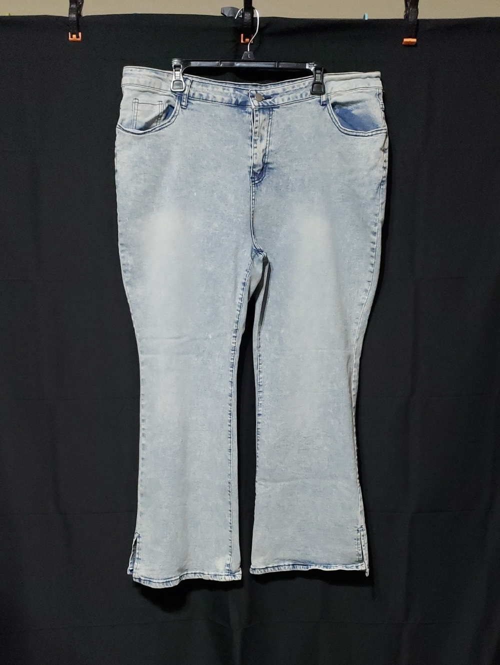 High-Rise Flare Jeans In A Light Acid Wash With Side Slits. Plus Size: 20 - 22